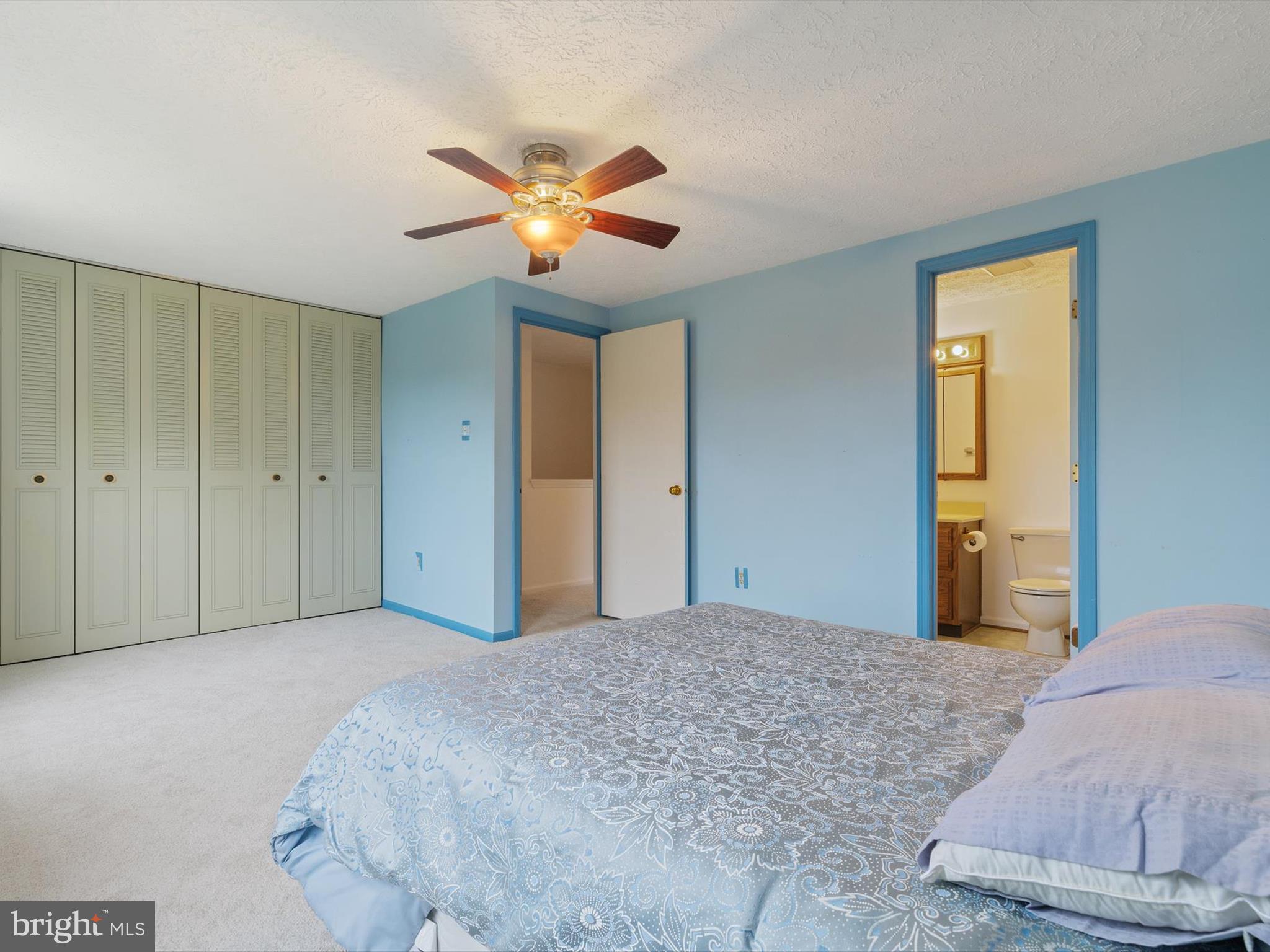 653 Willowby Run Pasadena, MD 21122 - Photo 16 of 31 a bedroom with a bed and a chandelier