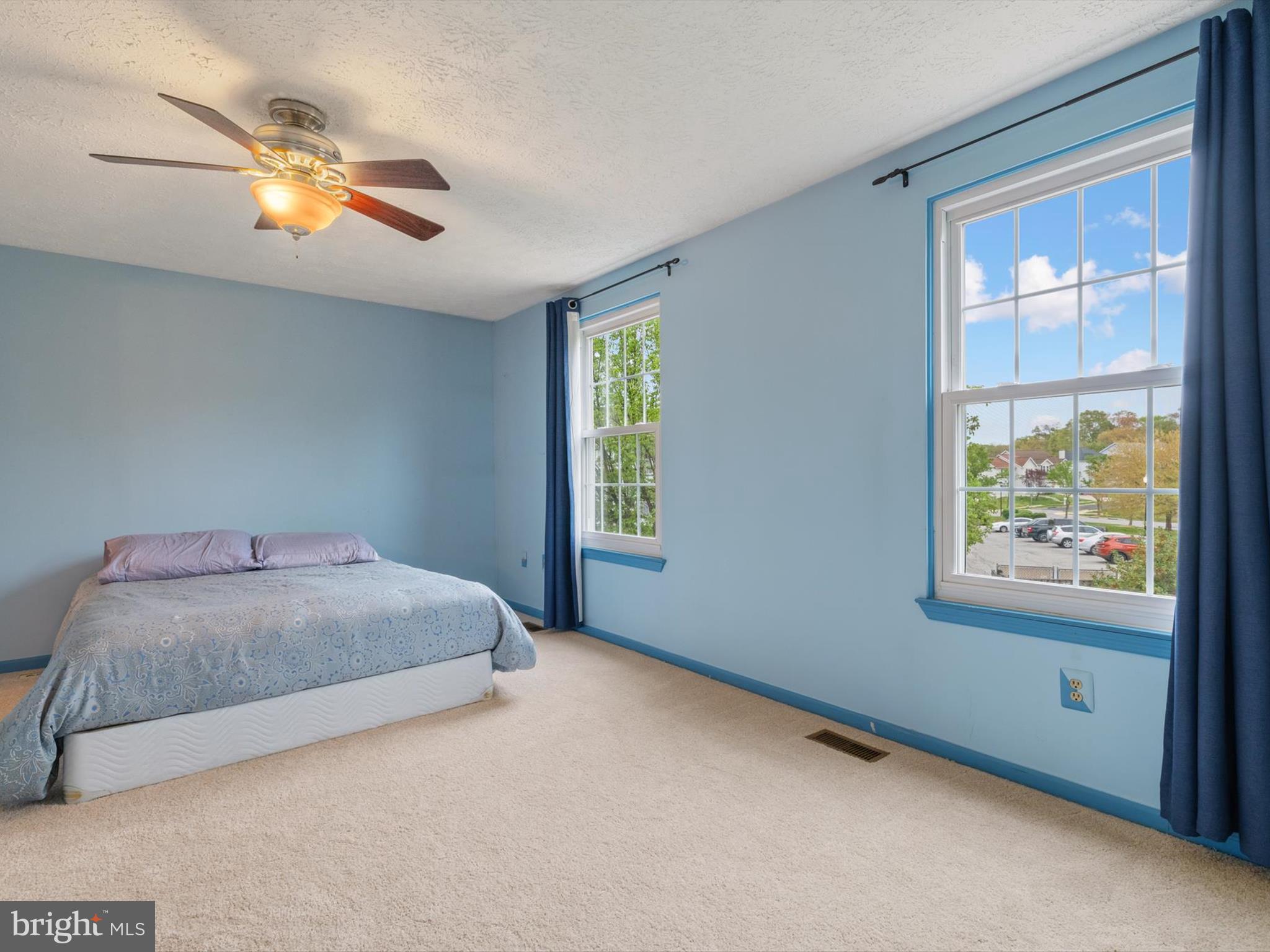 653 Willowby Run Pasadena, MD 21122 - Photo 18 of 31 a bedroom with a bed and a chandelier