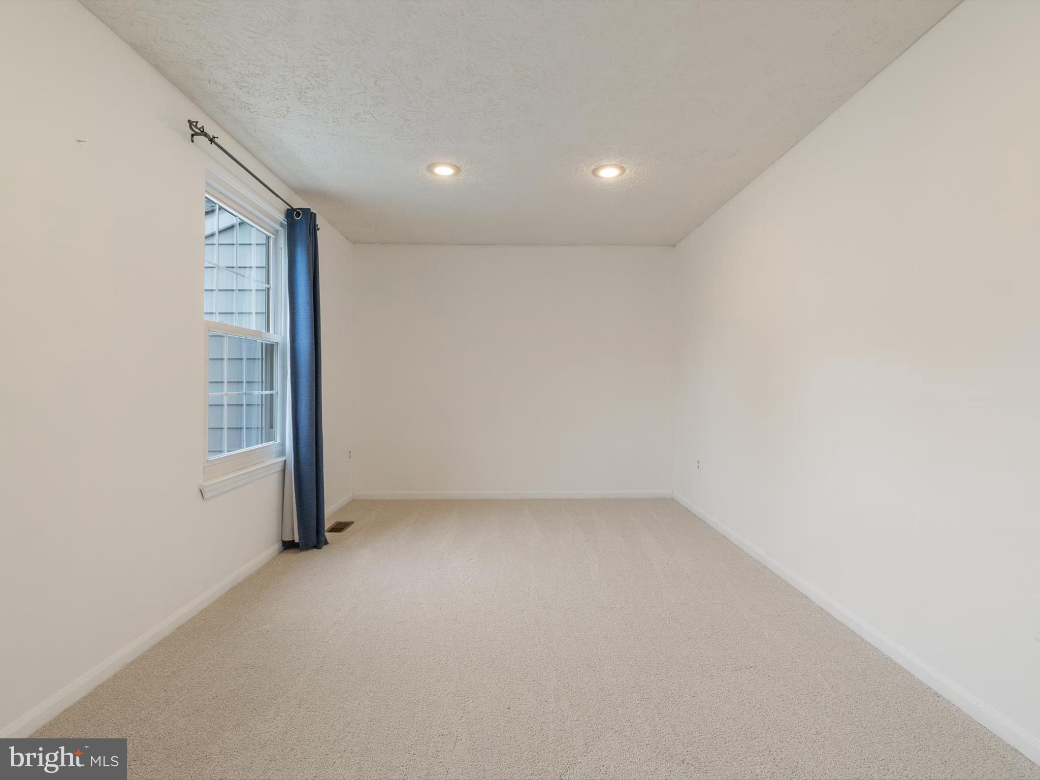 653 Willowby Run Pasadena, MD 21122 - Photo 21 of 31 an empty room with a empty space and windows