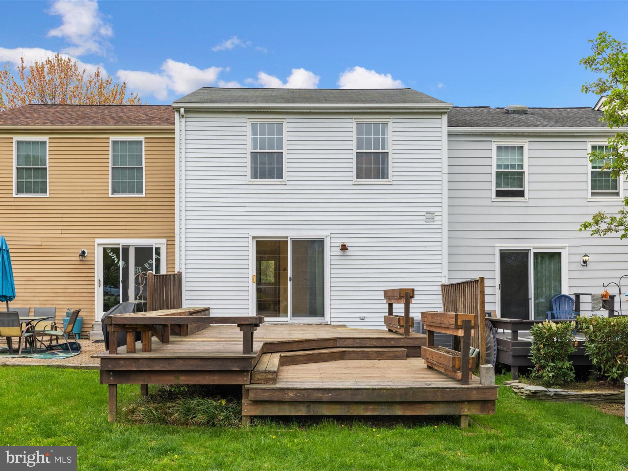 653 Willowby Run Pasadena, MD 21122 - Photo 30 of 31 a view of a house with patio and a yard