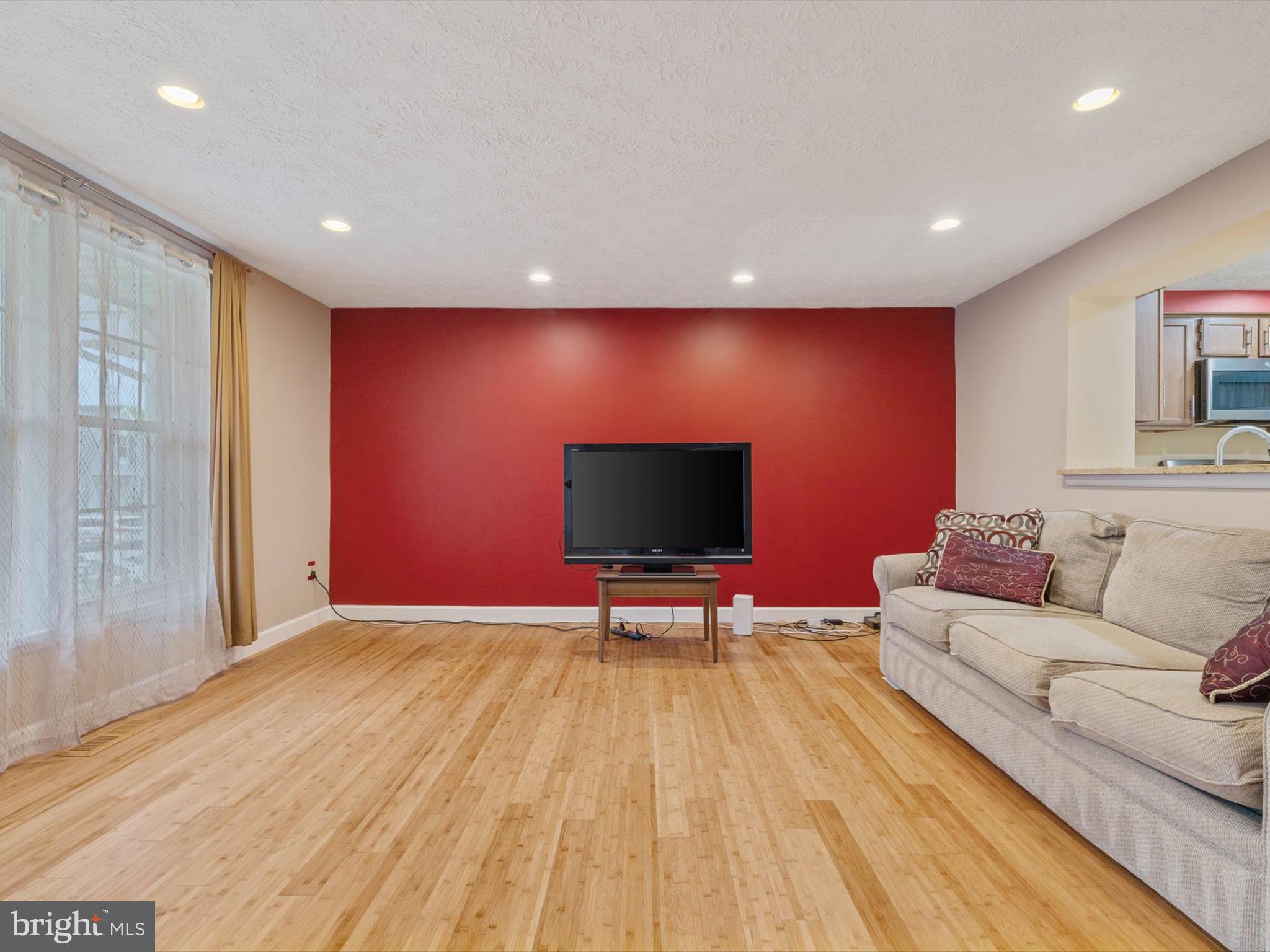 653 Willowby Run Pasadena, MD 21122 - Photo 4 of 31 a living room with furniture and a flat screen tv