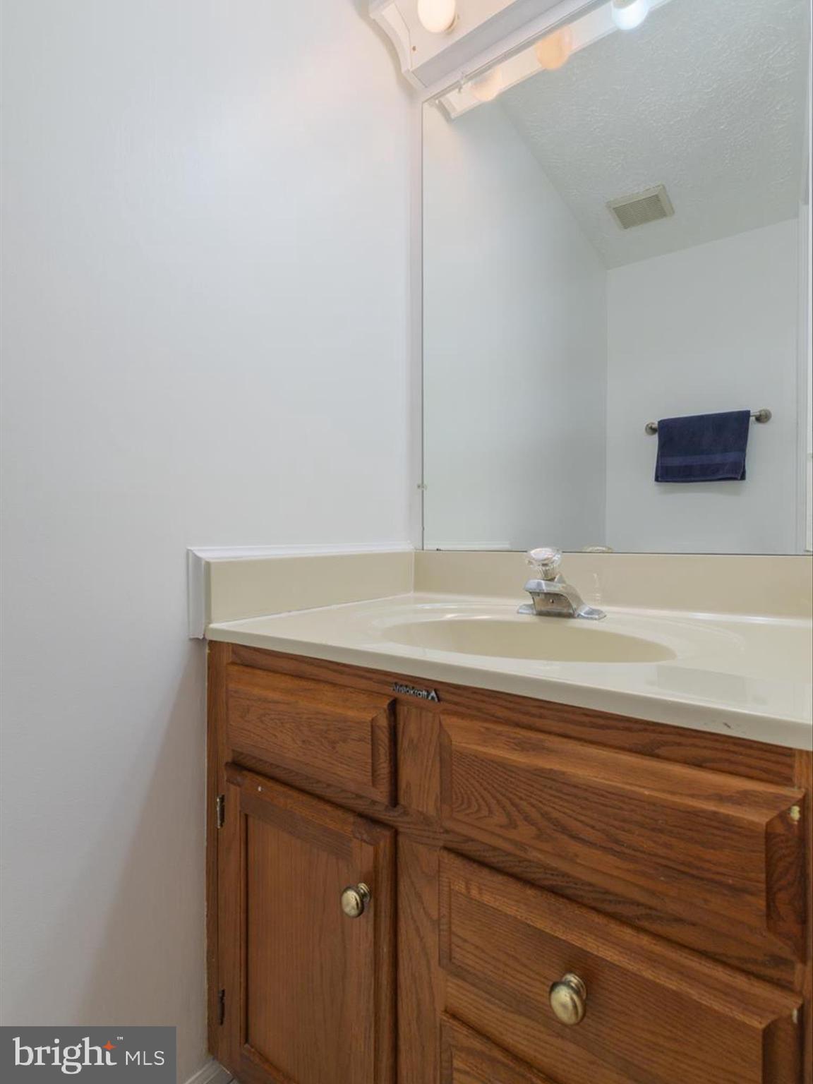 653 Willowby Run Pasadena, MD 21122 - Photo 7 of 31 a bathroom with a sink and a mirror