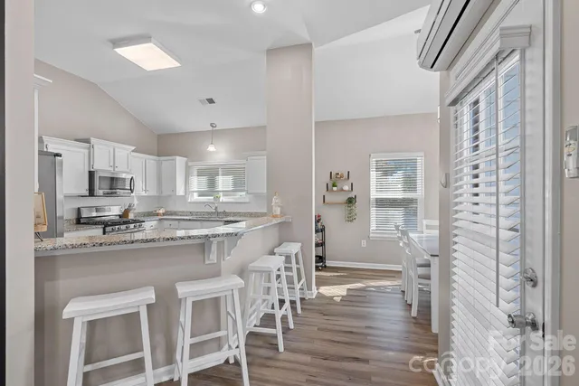 a dining room with furniture and window