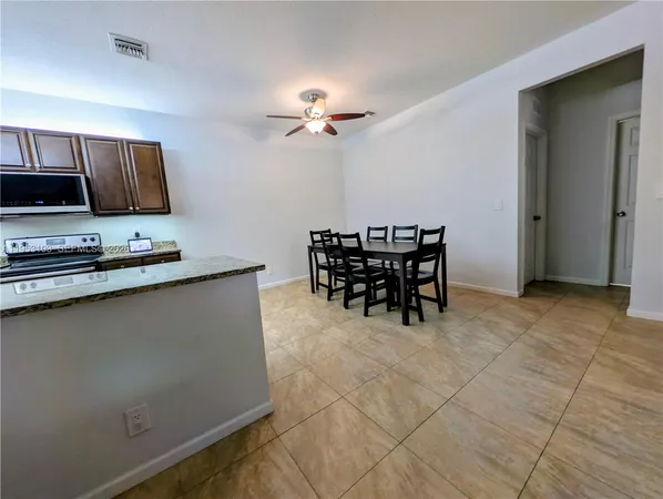 a view of a workspace with furniture