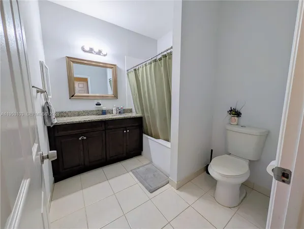 a bed room with a bed and a chair