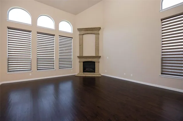 a view of a livingroom with wooden floor