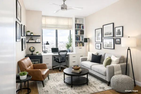 a work room with furniture and wooden floor