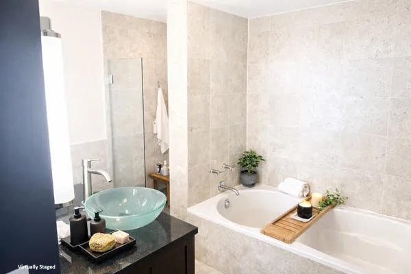 a bathroom with a sink vanity mirror and toilet