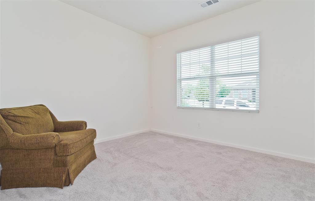 1637 Shadow Hawk Drive Fort Worth, TX 76052 - Photo 15 of 20 an empty room with furniture and a window