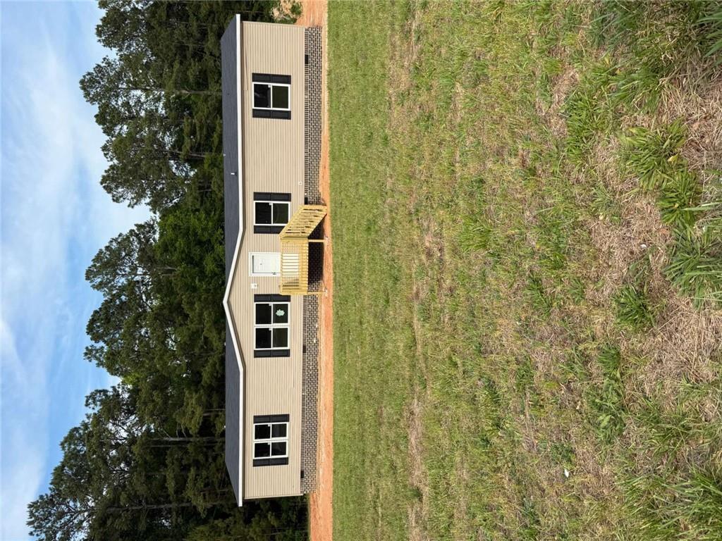 1052 Jones Ferry Road Elberton, GA 30635 - Photo 1 of 16 a front view of a house with a yard