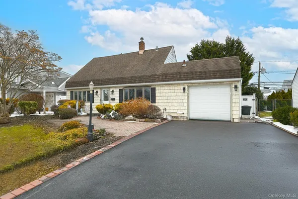 a view of a house with backyard and mountain view
