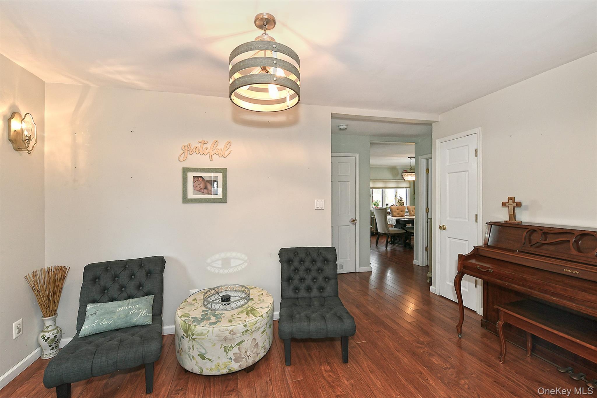 103 Ranch Lane Levittown, NY 11756 - Photo 11 of 29 a living room with furniture and wooden floor