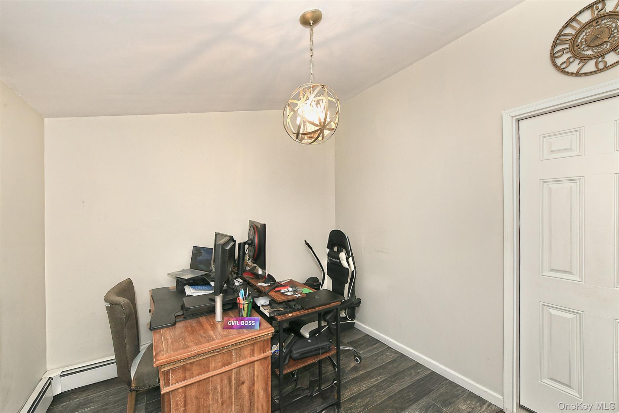 103 Ranch Lane Levittown, NY 11756 - Photo 14 of 29 a view of a workspace with furniture and wooden floor