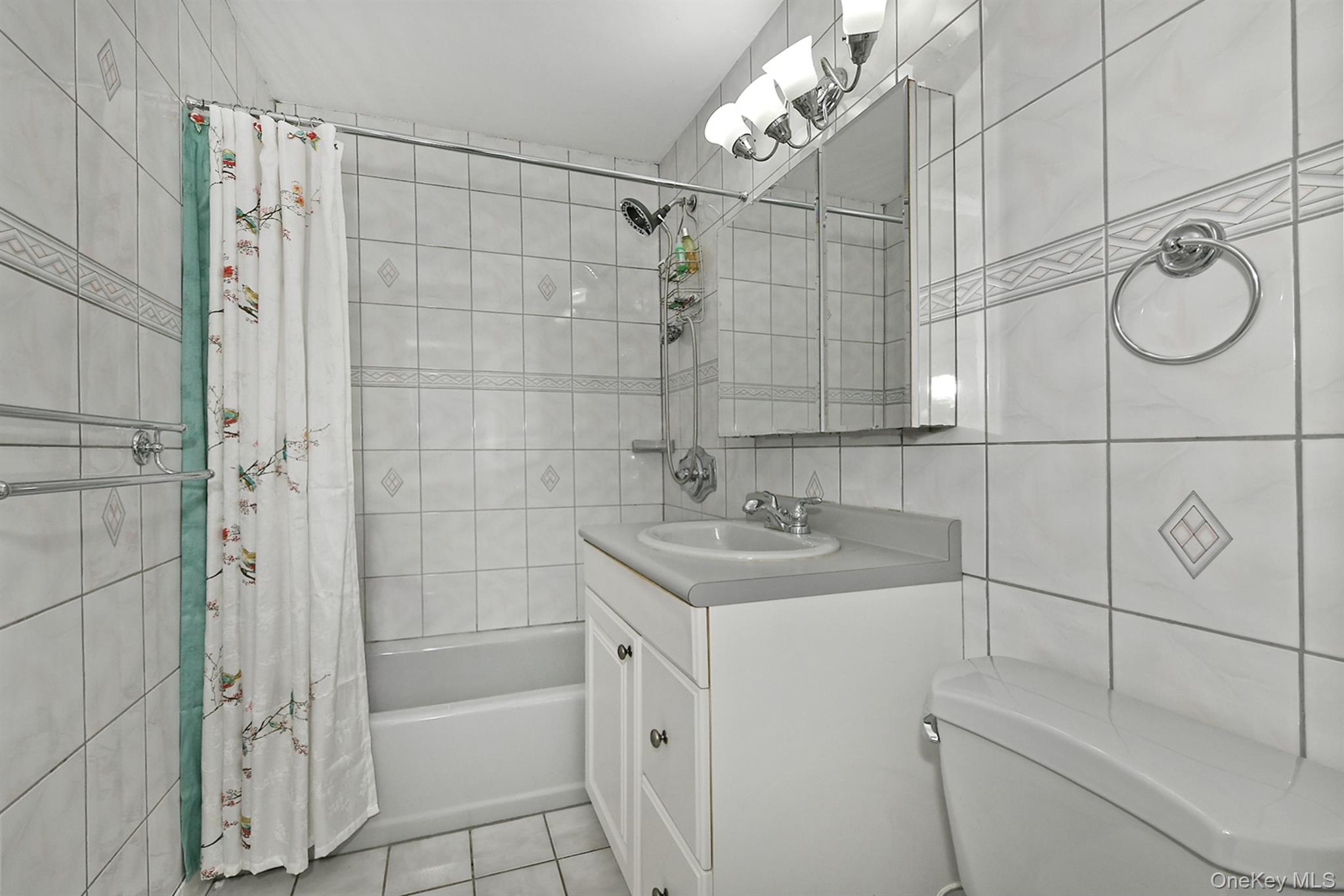 103 Ranch Lane Levittown, NY 11756 - Photo 16 of 29 a bathroom with a shower sink and mirror