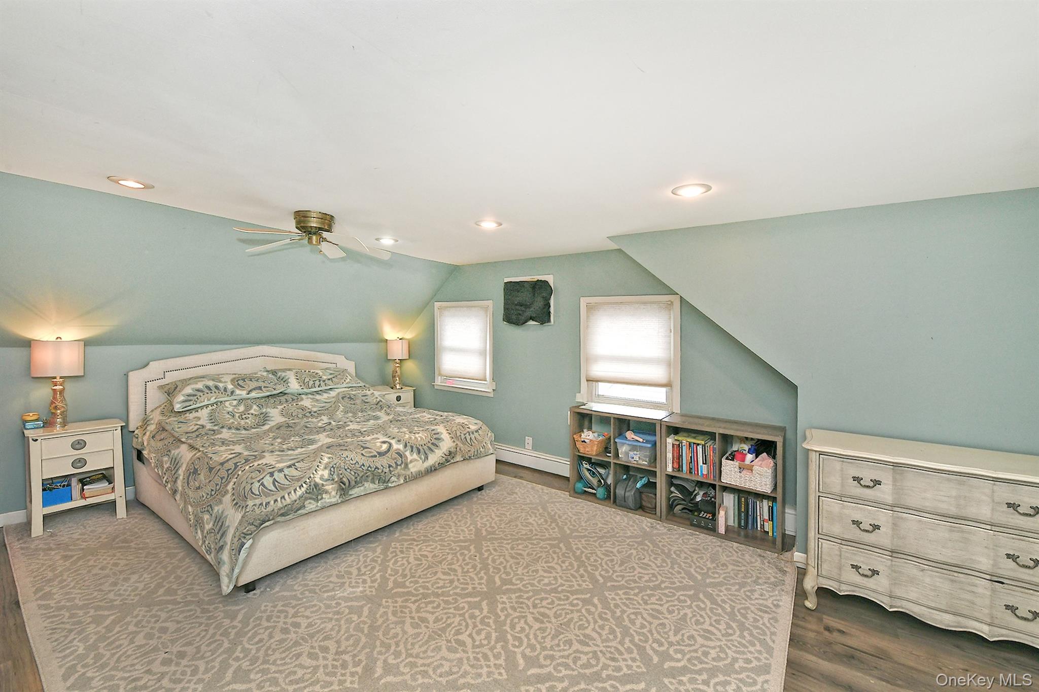 103 Ranch Lane Levittown, NY 11756 - Photo 17 of 29 a spacious bedroom with a large bed and a dresser
