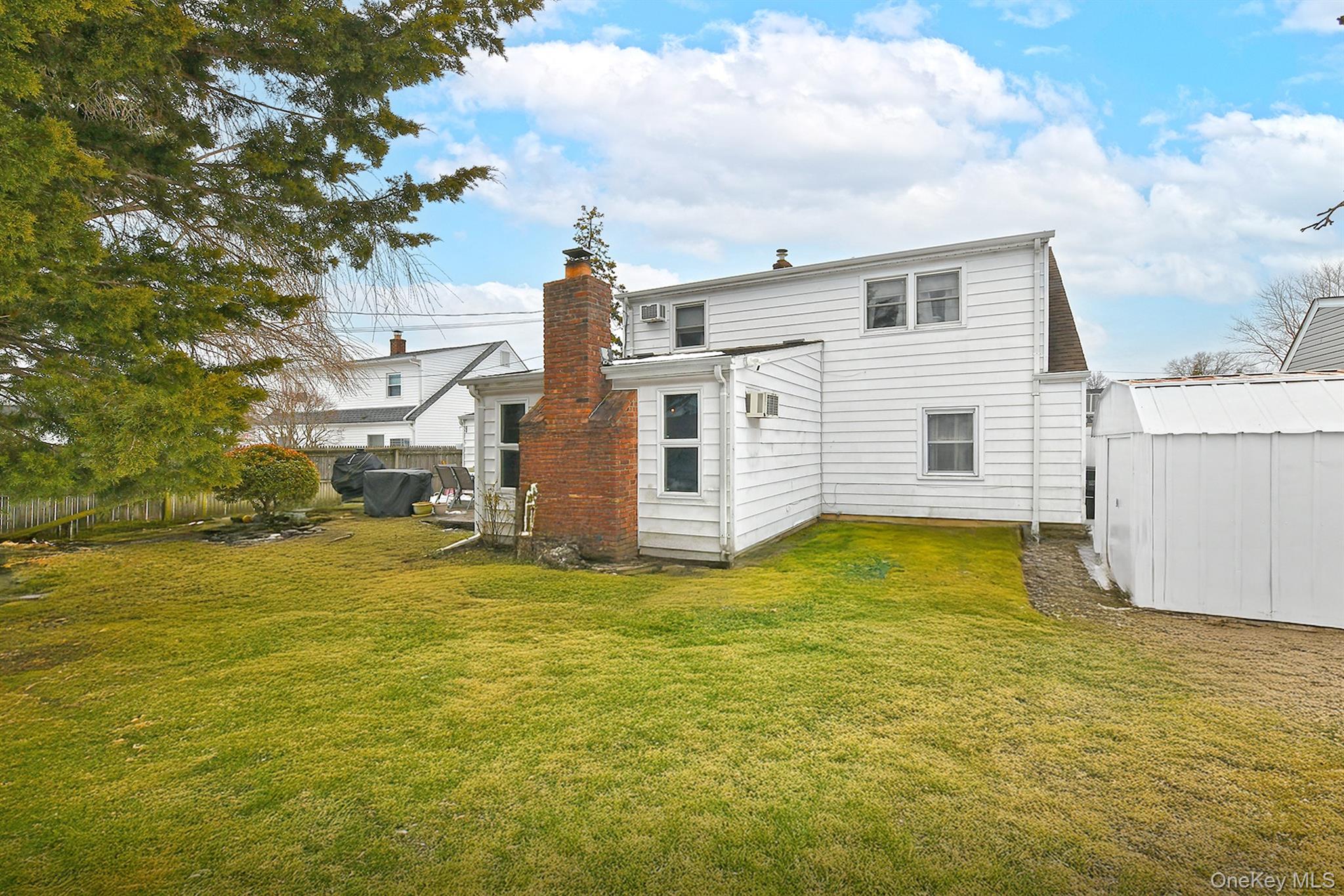 103 Ranch Lane Levittown, NY 11756 - Photo 23 of 29 a view of a house with a yard