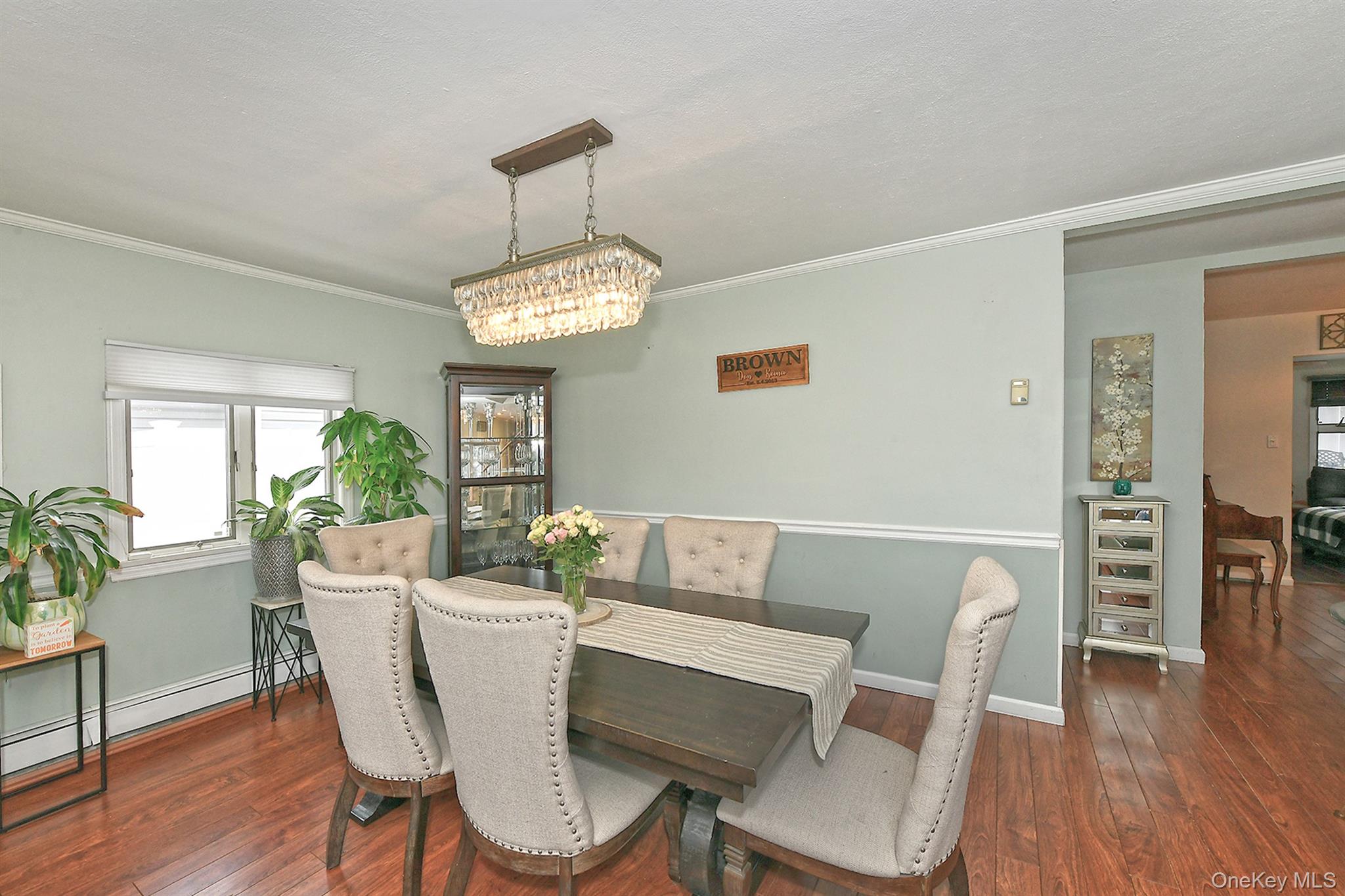 103 Ranch Lane Levittown, NY 11756 - Photo 5 of 29 a view of a dining room with furniture window and wooden floor