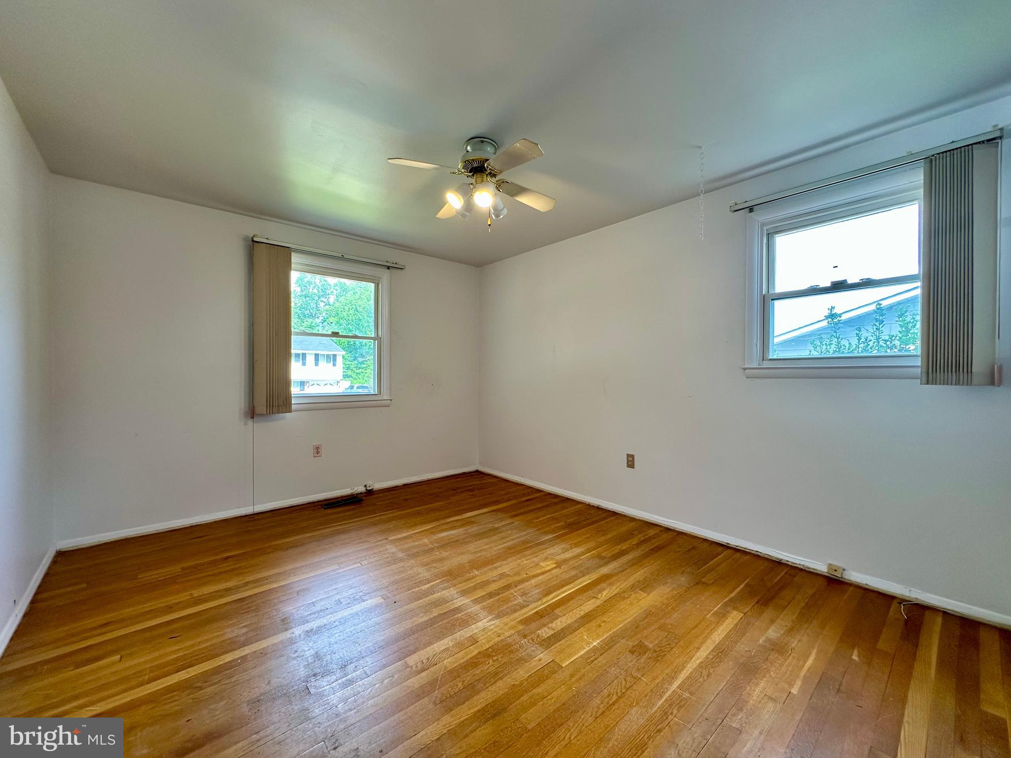 3916 Carthage Road Randallstown, MD 21133 - Photo 35 of 52 a view of empty room with wooden floor and fan