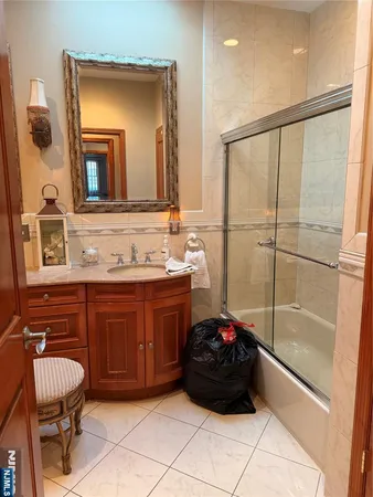 a bathroom with a sink a mirror and a bathtub