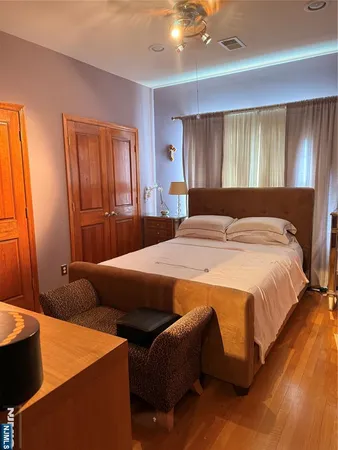 a bedroom with bed and window