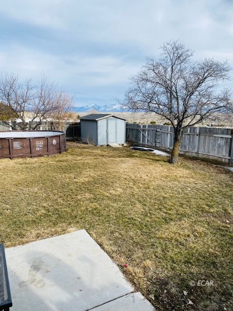 562 Spring Valley Parkway Spring Creek, NV 89815 - Photo 10 of 29 a view of a patio with a yard