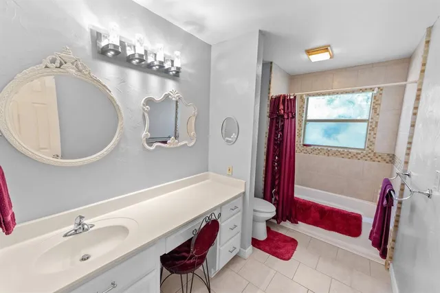 a bedroom with bed and a window