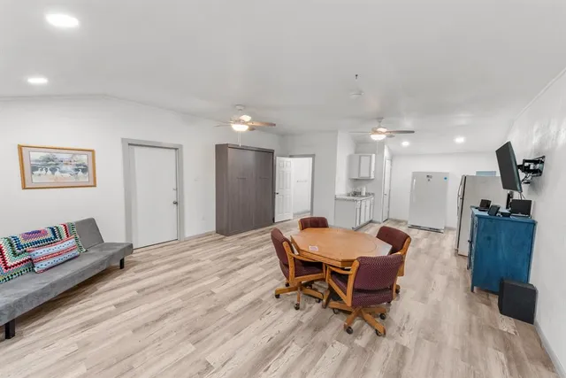 a bathroom with a toilet a sink and shower