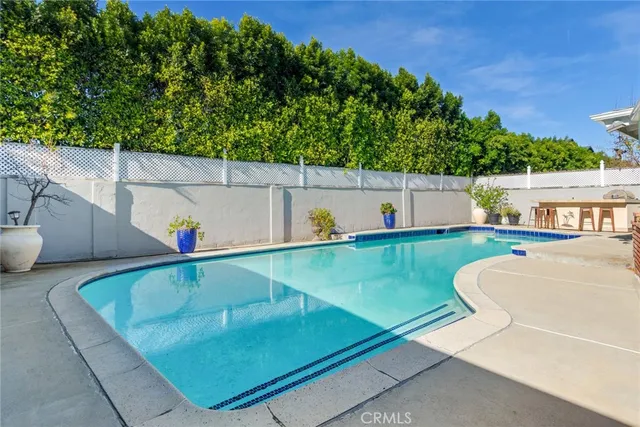 swimming pool view with a outdoor seating