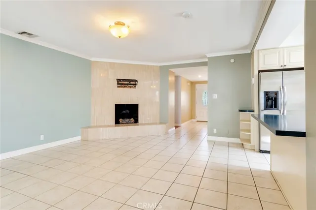 a view of a living room a bathroom with a sink and a mirror