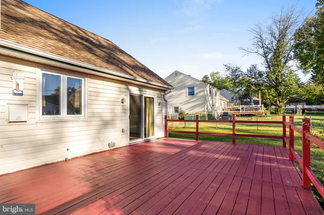 a view of a house with pool and wooden floor