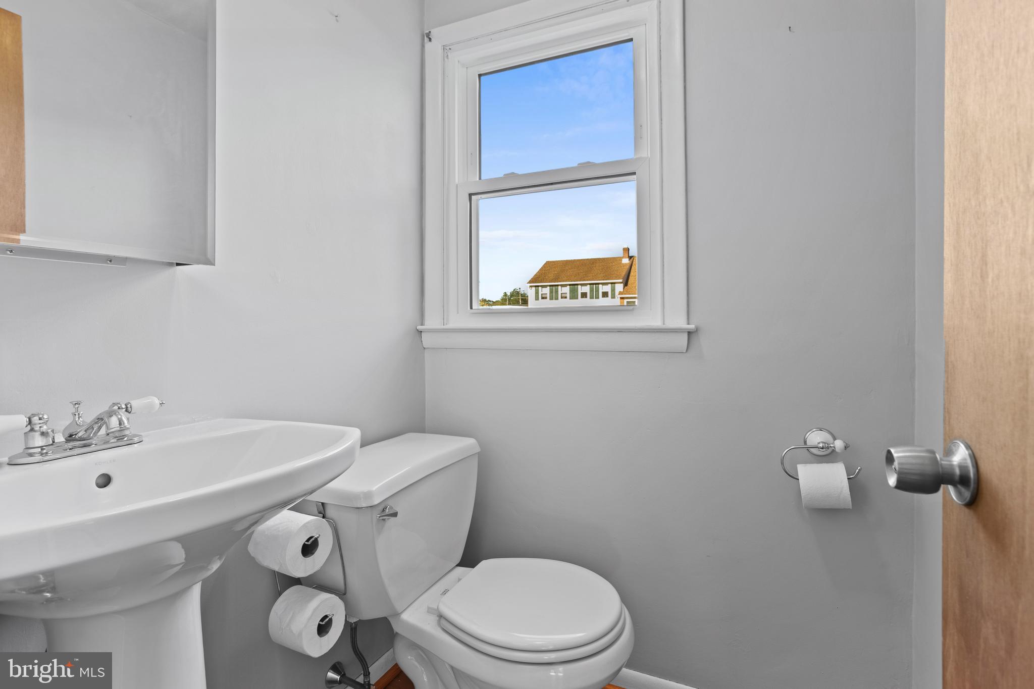 18 Cobblestone Lane Aston, PA 19014 - Photo 22 of 36 a bathroom with a sink mirror and toilet