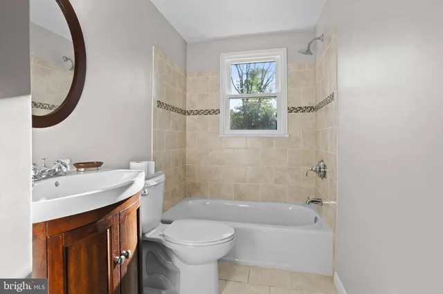 a bathroom with a sink toilet and a bathtub