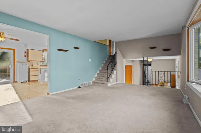 a view of an empty room with closet