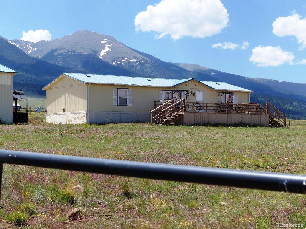985 Prairie Road Westcliffe, CO 81252 - Photo 1 of 35 a view of a house with a yard
