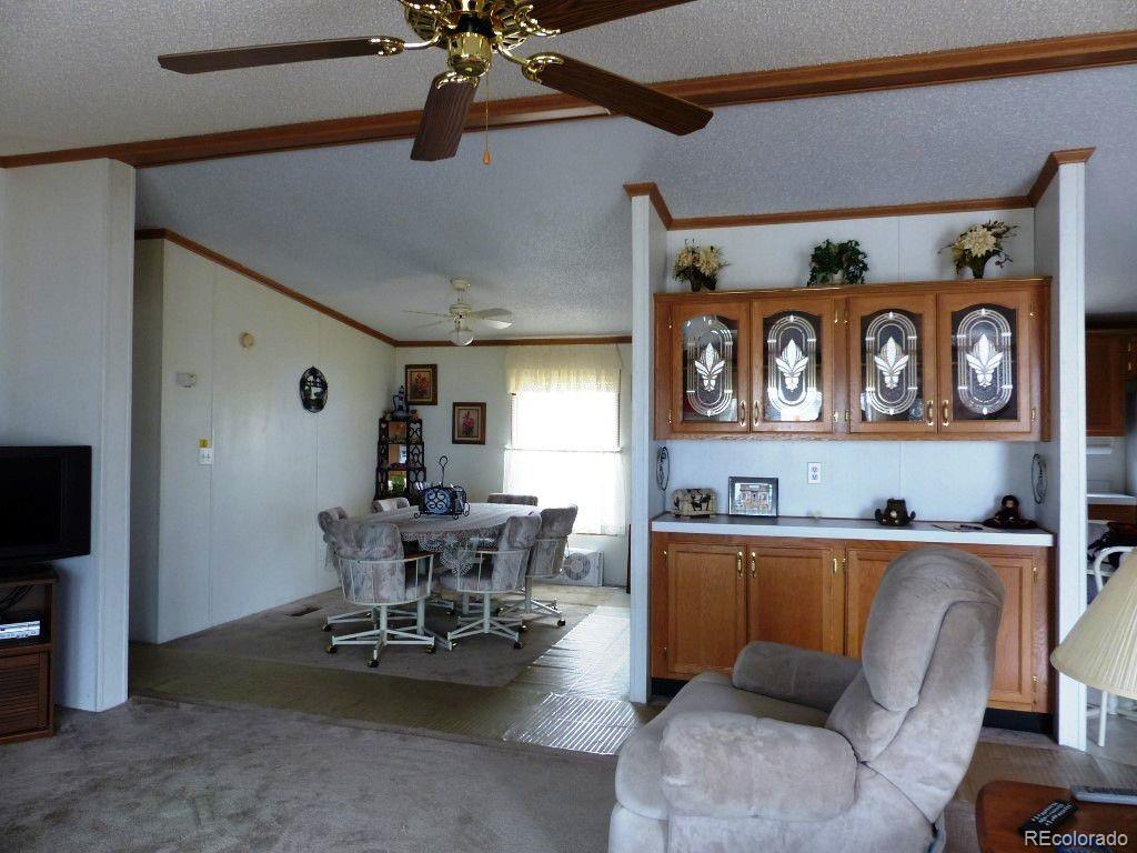 985 Prairie Road Westcliffe, CO 81252 - Photo 29 of 35 a dining room with furniture and view of kitchen
