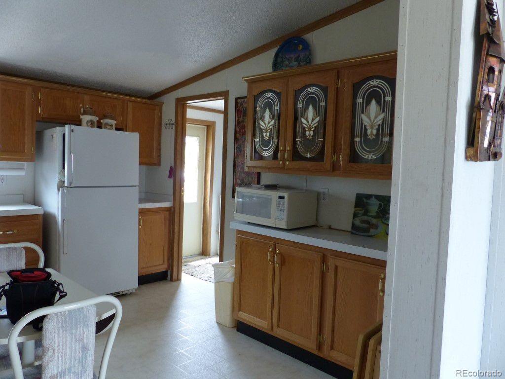 985 Prairie Road Westcliffe, CO 81252 - Photo 31 of 35 a hallway with storage and utility