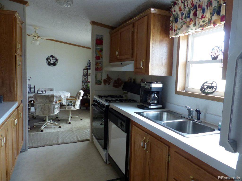 985 Prairie Road Westcliffe, CO 81252 - Photo 5 of 35 a kitchen with a sink cabinets and window