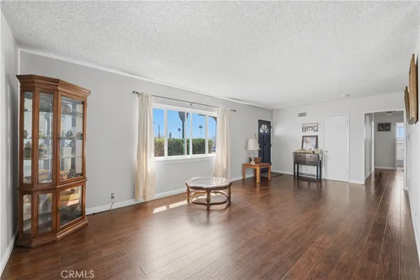 a view of a livingroom with furniture and wooden floor