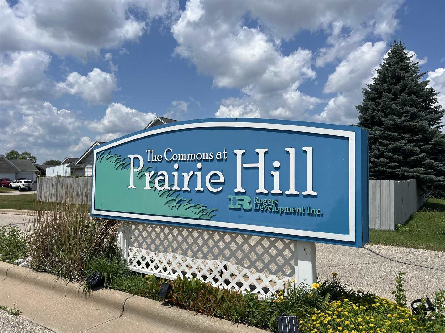 14358 Prairie Commons Lane South Beloit, IL 61080 - Photo 5 of 5 a sign on the side of a building