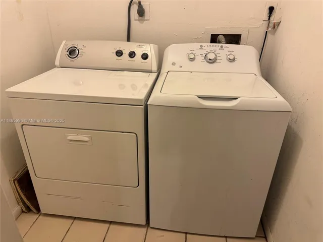 a patio with table and chairs