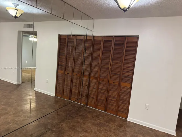 a view of entryway with wooden walls