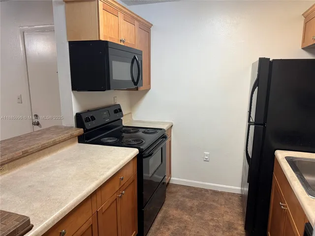 a kitchen with a stove and a microwave