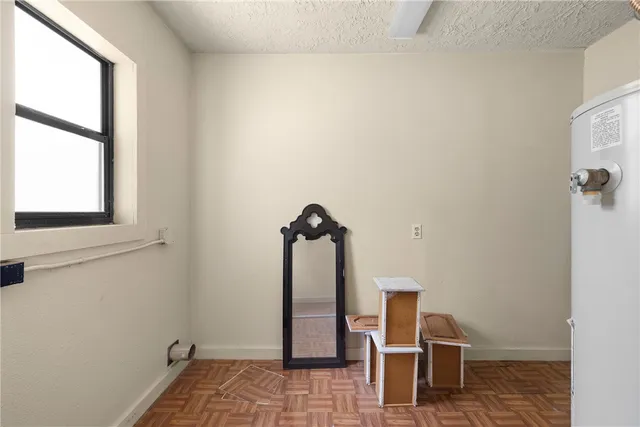 a view of a livingroom with wooden floor and a staircase