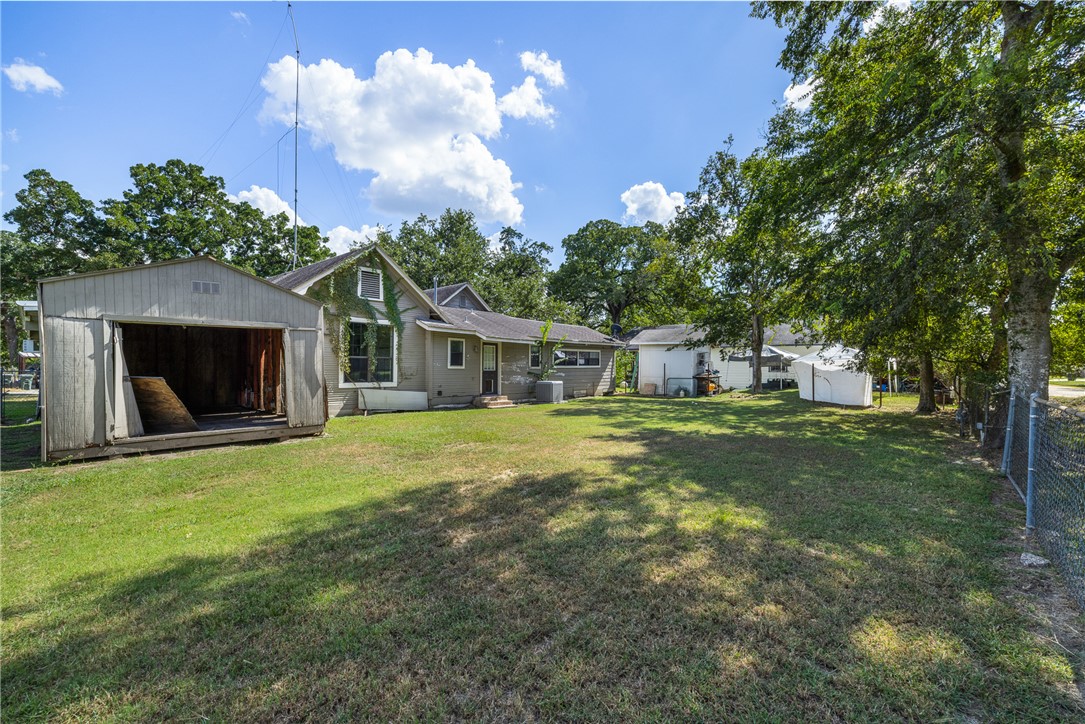 488 7th Street Somerville, TX 77879 - Photo 27 of 41 a front view of a house with garden