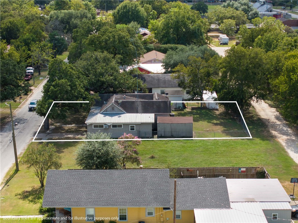 488 7th Street Somerville, TX 77879 - Photo 29 of 41 a view of a back yard with a patio