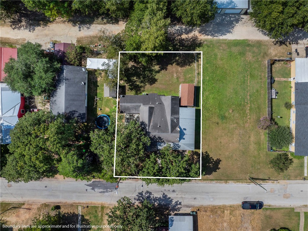 488 7th Street Somerville, TX 77879 - Photo 3 of 41 an aerial view of residential house with outdoor space and parking