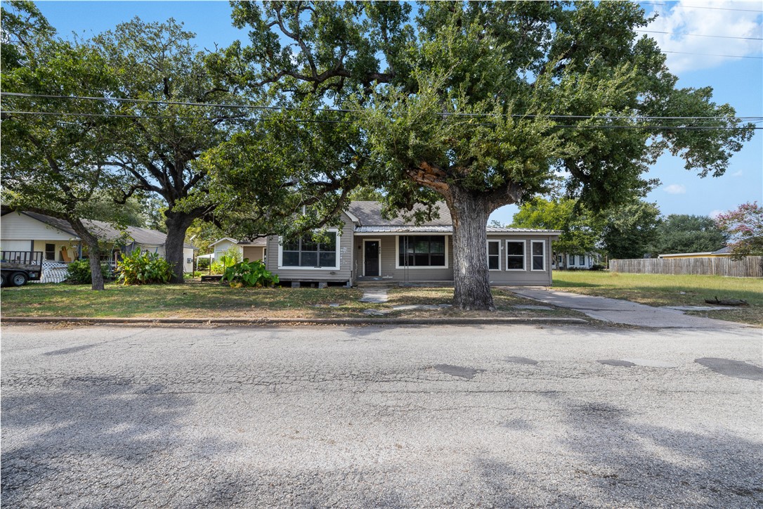 488 7th Street Somerville, TX 77879 - Photo 4 of 41 a front view of a house with a yard