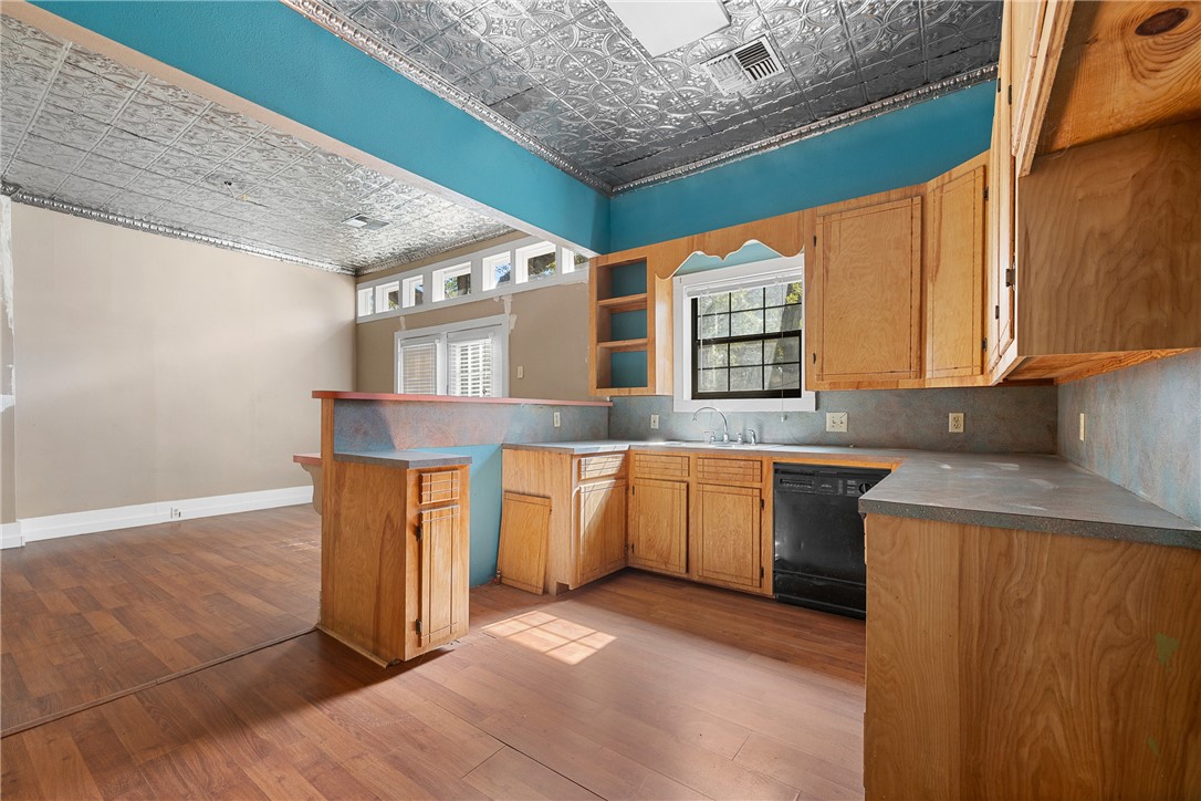 488 7th Street Somerville, TX 77879 - Photo 10 of 41 a kitchen with granite countertop a sink and a stove