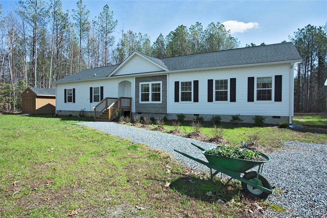 1496 Elsom Mascot Road Mattaponi, VA 23110 - Photo 1 of 33 a front view of a house with garden