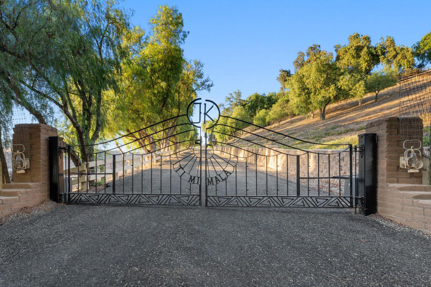 1750 Rambling Oaks Road Santa Ynez, CA 93460 - Photo 21 of 45 a view of a house with a garage